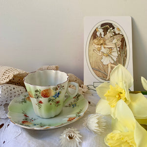 Pretty vintage hand painted miniature tea cup & saucer
