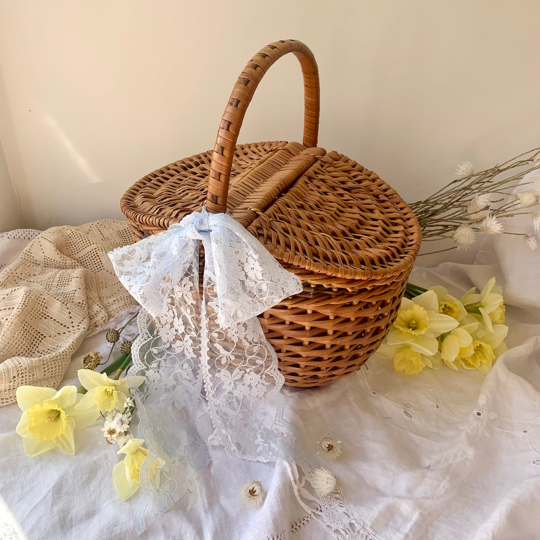 Vintage wicker picnic style lidded basket